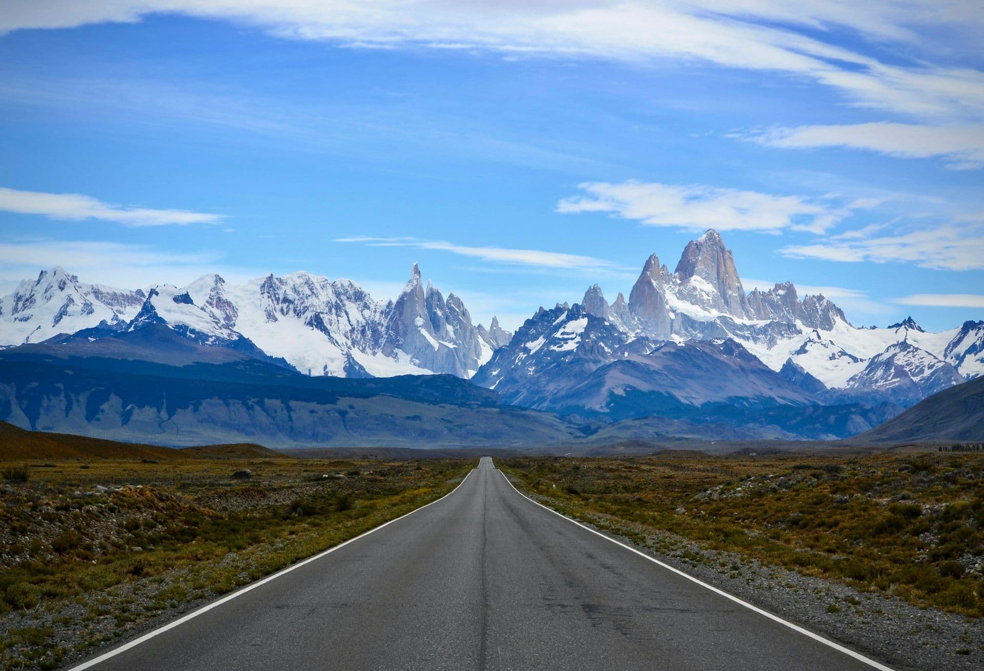 A straight road leading to the snowy peaks of Fitz Roy