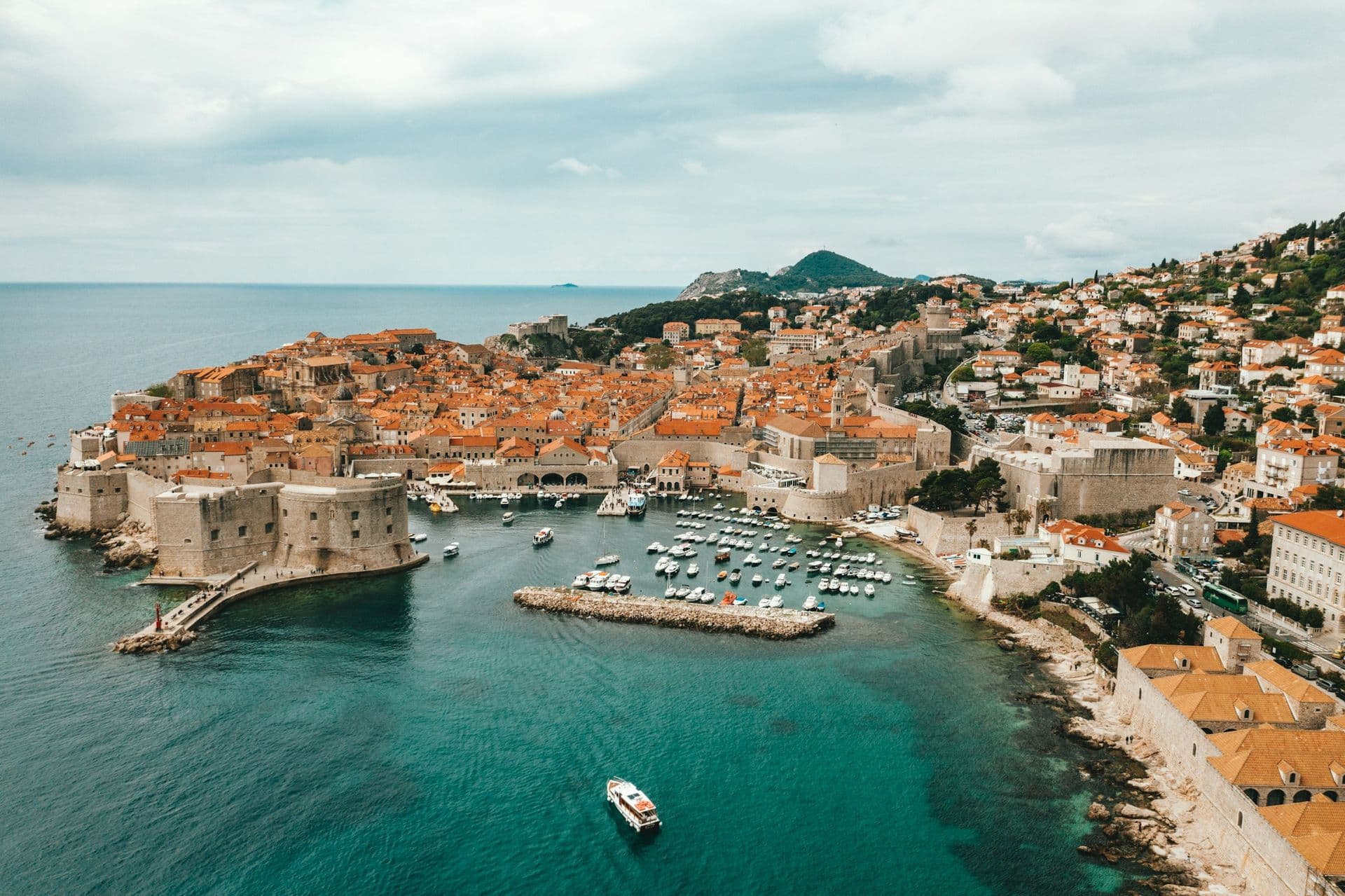 The walled old town of Dubrovnik and its harbour from above